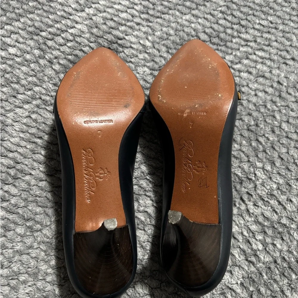 Brooks Brothers black leather fringe and buckle pointed toe heels. Size 7